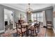 Elegant dining room featuring stylish decor, a striking chandelier, and abundant natural light at 4000 N Stratford Ne Rd, Atlanta, GA 30342