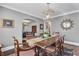 Charming dining room featuring stylish decor, a striking chandelier, and seamless access to the living areas at 4000 N Stratford Ne Rd, Atlanta, GA 30342