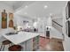 Updated kitchen with white cabinets, a breakfast bar and a wine refrigerator at 4000 N Stratford Ne Rd, Atlanta, GA 30342