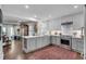 Open kitchen boasts updated appliances, white countertops, gray cabinets and dark wood floors at 4000 N Stratford Ne Rd, Atlanta, GA 30342