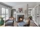 Elegant living room featuring a cozy fireplace, classic decor, and a seamless flow into other spaces at 4000 N Stratford Ne Rd, Atlanta, GA 30342