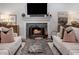 Comfortable living room featuring a stone fireplace and bright lighting at 4000 N Stratford Ne Rd, Atlanta, GA 30342