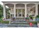 Charming front patio adorned with string lights, potted plants, and decorative accents at 4000 N Stratford Ne Rd, Atlanta, GA 30342