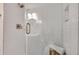 Close up of a modern shower with white subway tile and brass fixtures at 4000 N Stratford Ne Rd, Atlanta, GA 30342