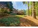 Beautiful backyard featuring a wooden deck, well-maintained lawn, and mature trees at 4183 Oak Crest Dr, Tucker, GA 30084