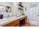 Bathroom with wood cabinets, a granite countertop, and tiled floors at 4183 Oak Crest Dr, Tucker, GA 30084
