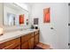 Well-lit bathroom features wood cabinets, updated vanity, and modern fixtures at 4183 Oak Crest Dr, Tucker, GA 30084
