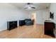 Spacious bedroom featuring a ceiling fan, hardwood floors, and closet access at 4183 Oak Crest Dr, Tucker, GA 30084
