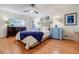 Cozy bedroom with a comfortable bed, wood floors, and stylish blue accents at 4183 Oak Crest Dr, Tucker, GA 30084