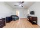 Spacious bedroom featuring a ceiling fan, hardwood floors, and closet access at 4183 Oak Crest Dr, Tucker, GA 30084