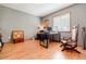 Bedroom with hardwood floors, a window, a desk, and a chair at 4183 Oak Crest Dr, Tucker, GA 30084