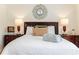 Bedroom with hardwood floors, a bed, nightstands, and lamps at 4183 Oak Crest Dr, Tucker, GA 30084