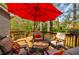 Inviting backyard deck with outdoor seating and lush trees in the background at 4183 Oak Crest Dr, Tucker, GA 30084