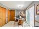 Dining area with sliding glass door to deck and wood trim at 4183 Oak Crest Dr, Tucker, GA 30084