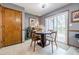 Eat-in dining area next to glass doors, featuring wood trim and tile floors at 4183 Oak Crest Dr, Tucker, GA 30084