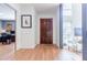 Entryway with hardwood floors, a dark wood door, and a window at 4183 Oak Crest Dr, Tucker, GA 30084