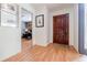 Entryway with hardwood floors, a dark wood door, and a picture on the wall at 4183 Oak Crest Dr, Tucker, GA 30084