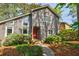 Attractive two-story home with gray siding, large windows, and a vibrant red front door at 4183 Oak Crest Dr, Tucker, GA 30084
