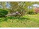 Beautifully landscaped front yard with mature trees providing shade and curb appeal at 4183 Oak Crest Dr, Tucker, GA 30084