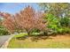 Front yard features a beautiful blooming tree on the property, complementing its scenic charm at 4183 Oak Crest Dr, Tucker, GA 30084
