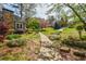 Landscaped front yard with walkway leading to the home in a quiet neighborhood at 4183 Oak Crest Dr, Tucker, GA 30084