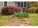 Front yard landscaping with shrubs and flowers near the house, adding curb appeal at 4183 Oak Crest Dr, Tucker, GA 30084