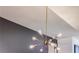 A modern chandelier with multiple bulbs creating a stylish lighting feature at 4183 Oak Crest Dr, Tucker, GA 30084