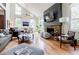 Spacious living room with hardwood floors, stone fireplace, and plenty of natural light at 4183 Oak Crest Dr, Tucker, GA 30084