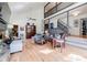 Open-concept living room with hardwood floors, vaulted ceilings, fireplace, and staircase to the second floor at 4183 Oak Crest Dr, Tucker, GA 30084