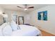 Bright main bedroom with ceiling fan, white walls, and ensuite bathroom at 4183 Oak Crest Dr, Tucker, GA 30084