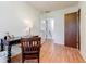 Office space with a dark-colored desk, hardwood floors, and a window at 4183 Oak Crest Dr, Tucker, GA 30084