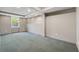 Spacious unfinished basement with neutral colors and lots of light at 1075 Pebble Bend Dr, Grayson, GA 30017