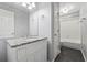 Bathroom features a modern vanity, granite countertop, and neutral decor at 1075 Pebble Bend Dr, Grayson, GA 30017