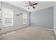 Bedroom with dual windows, a ceiling fan, and natural light at 1075 Pebble Bend Dr, Grayson, GA 30017