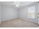 Standard bedroom with a ceiling fan and natural light from a window at 1075 Pebble Bend Dr, Grayson, GA 30017