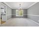 Well-lit dining room featuring neutral walls and plush carpeting with views of the kitchen at 1075 Pebble Bend Dr, Grayson, GA 30017