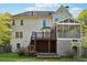 Back exterior view of home with deck, patio, and screened porch at 1075 Pebble Bend Dr, Grayson, GA 30017