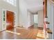 Inviting foyer with hardwood floors, natural light and a view of the staircase and adjacent rooms at 1075 Pebble Bend Dr, Grayson, GA 30017