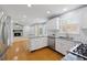Spacious kitchen boasting granite countertops, white cabinets, and stainless steel appliances at 1075 Pebble Bend Dr, Grayson, GA 30017
