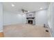 Comfortable living room featuring a stone fireplace and ample natural light at 1075 Pebble Bend Dr, Grayson, GA 30017