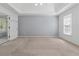 Main bedroom features tray ceiling and natural light at 1075 Pebble Bend Dr, Grayson, GA 30017