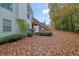 Home's backyard featuring foliage and back deck with wooden stairs going to the yard at 777 Glen Valley Way, Dacula, GA 30019