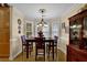 Cozy dining room featuring a bay window, hardwood floors, and elegant furnishings at 777 Glen Valley Way, Dacula, GA 30019