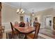 A bright dining room featuring a dining table set, wood accents, and neutral walls at 777 Glen Valley Way, Dacula, GA 30019