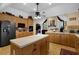 Spacious kitchen with wooden cabinets, a kitchen island, and modern appliances at 777 Glen Valley Way, Dacula, GA 30019
