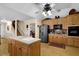 A kitchen with wooden cabinets, a kitchen island, and stainless steel refrigerator at 777 Glen Valley Way, Dacula, GA 30019