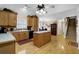 Spacious kitchen with wooden cabinets, an island, and hardwood floors at 777 Glen Valley Way, Dacula, GA 30019