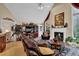 Open living room featuring a fireplace, vaulted ceilings, a large television, and comfortable leather sofas at 777 Glen Valley Way, Dacula, GA 30019