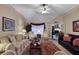 The comfortable living room features a seating area with furniture, a fireplace, and natural light at 777 Glen Valley Way, Dacula, GA 30019