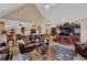 Cozy living area with hardwood floors, traditional furniture, and an open view to the kitchen and dining area at 777 Glen Valley Way, Dacula, GA 30019